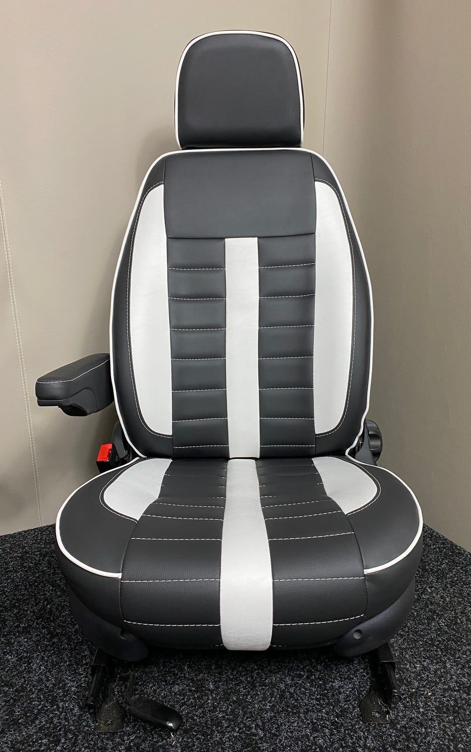 MK1 Replacement Swivel Captain Seat front view showing black leatherette with white centre panel, white piping, wide horizontal stitching and one armrest.
