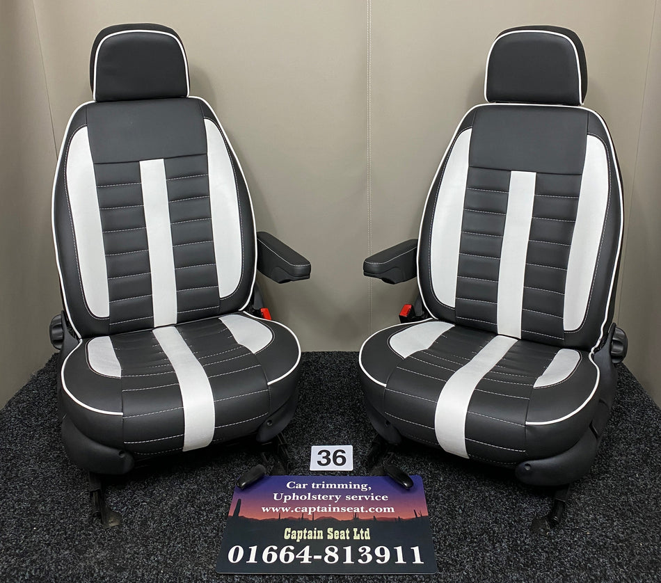MK1 Replacement Swivel Captain Seats in black leatherette with white centre panels, inserts, wide horizontal stitching and one armrest per seat.