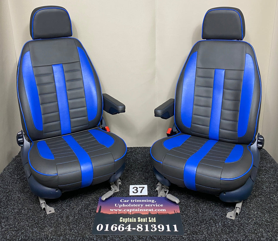 MK1 Replacement Swivel Captain Seats in black leatherette with blue leatherette centre panels, piping and inserts, dark blue plastic trim and one armrest per seat.