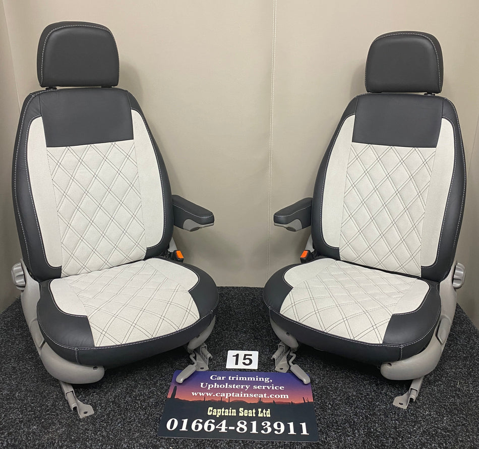 Pair of MK1 Replacement Captain Swivel Seats in black Nappa leather with white microfibre centre panels, with one armrest per seat.
