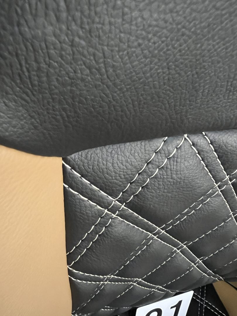 MK1 Swivel Replacement Captain Seat, close-up of the matt black leatherette backrest with Bentley stitching and beige insert.