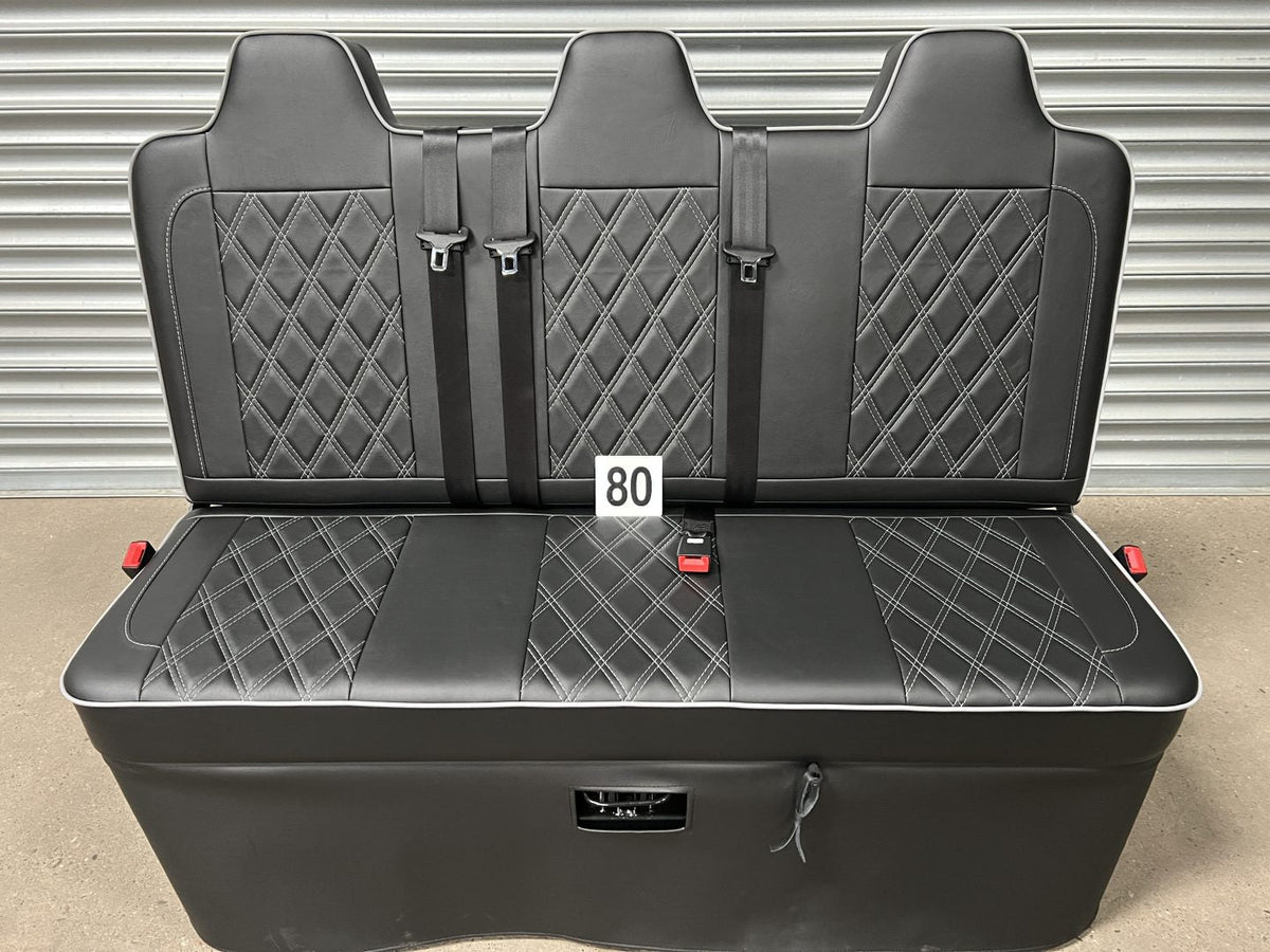 Rock and roll bed full width 3 seater M1 tested gas assisted Legged in black leatherette with grey Bentley cross stitching, grey piping and integrated seatbelts.
