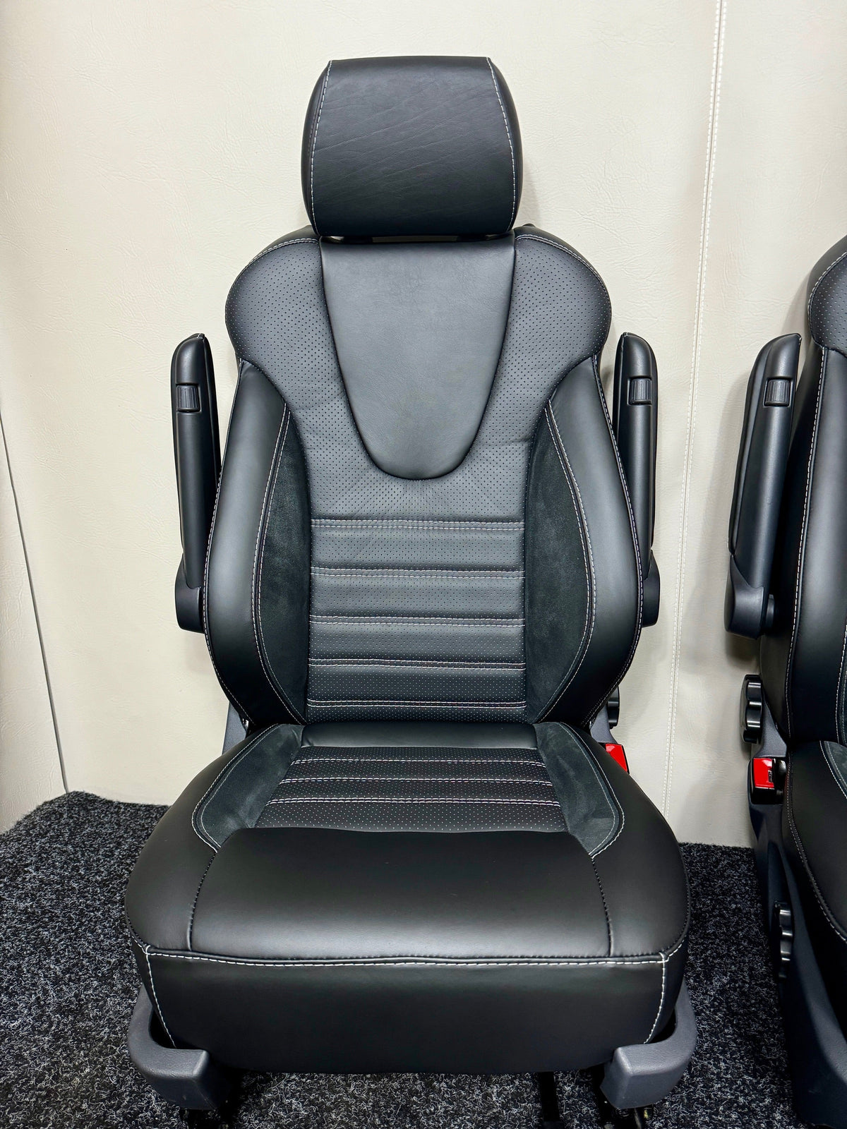 VW T5 T6 Factory Front Seat Wing Back in black Nappa leather with perforated centre panel and Alcantara inserts, double armrests, and light grey horizontal stitching.