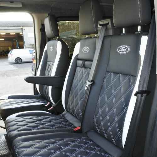 Ford Transit & Custom Front Seat Sets upholstered in black leatherette with white Bentley stitch pattern, Ford logos and edges.
