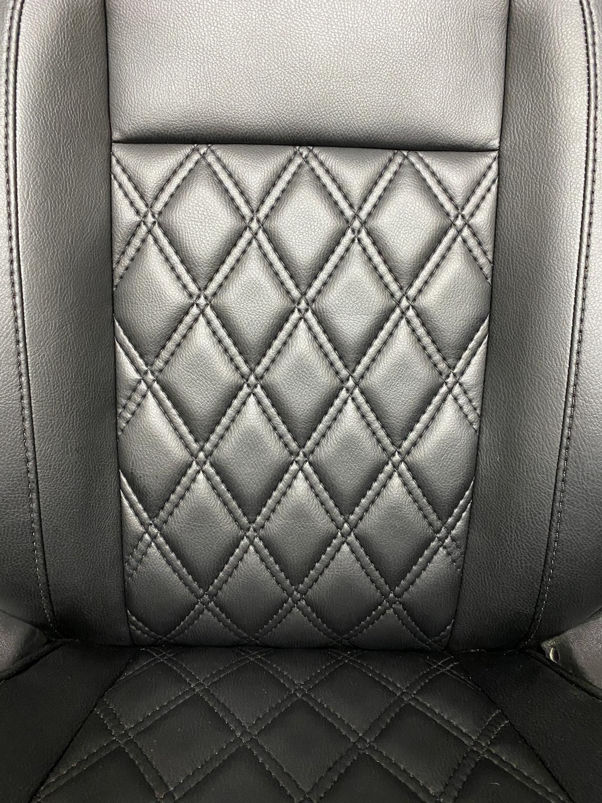Close-up of Ford Transit Custom Seat featuring black leatherette upholstery with Bentley diamond stitch pattern.
