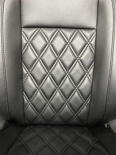 Close-up of Ford Transit Custom Seat featuring black leatherette upholstery with Bentley diamond stitch pattern.