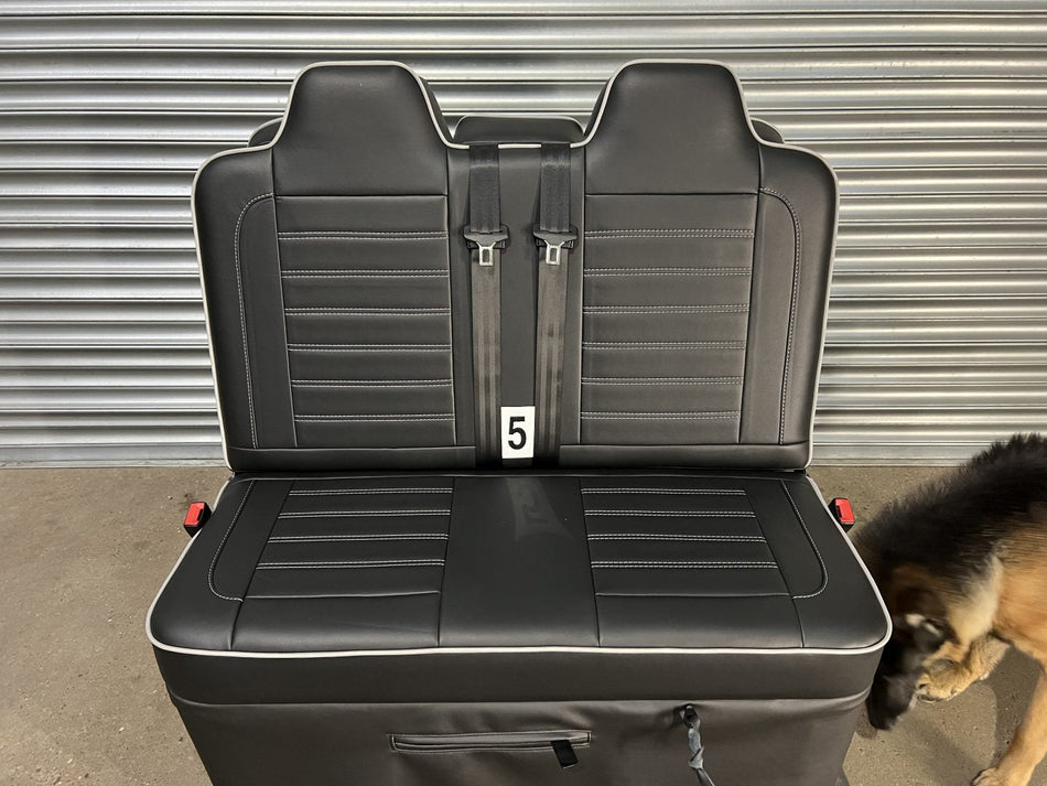 M1 Tested Gas Assisted 3/4 size Rock & Roll Bed in black leatherette upholstery with grey piping and horizontal stitching.