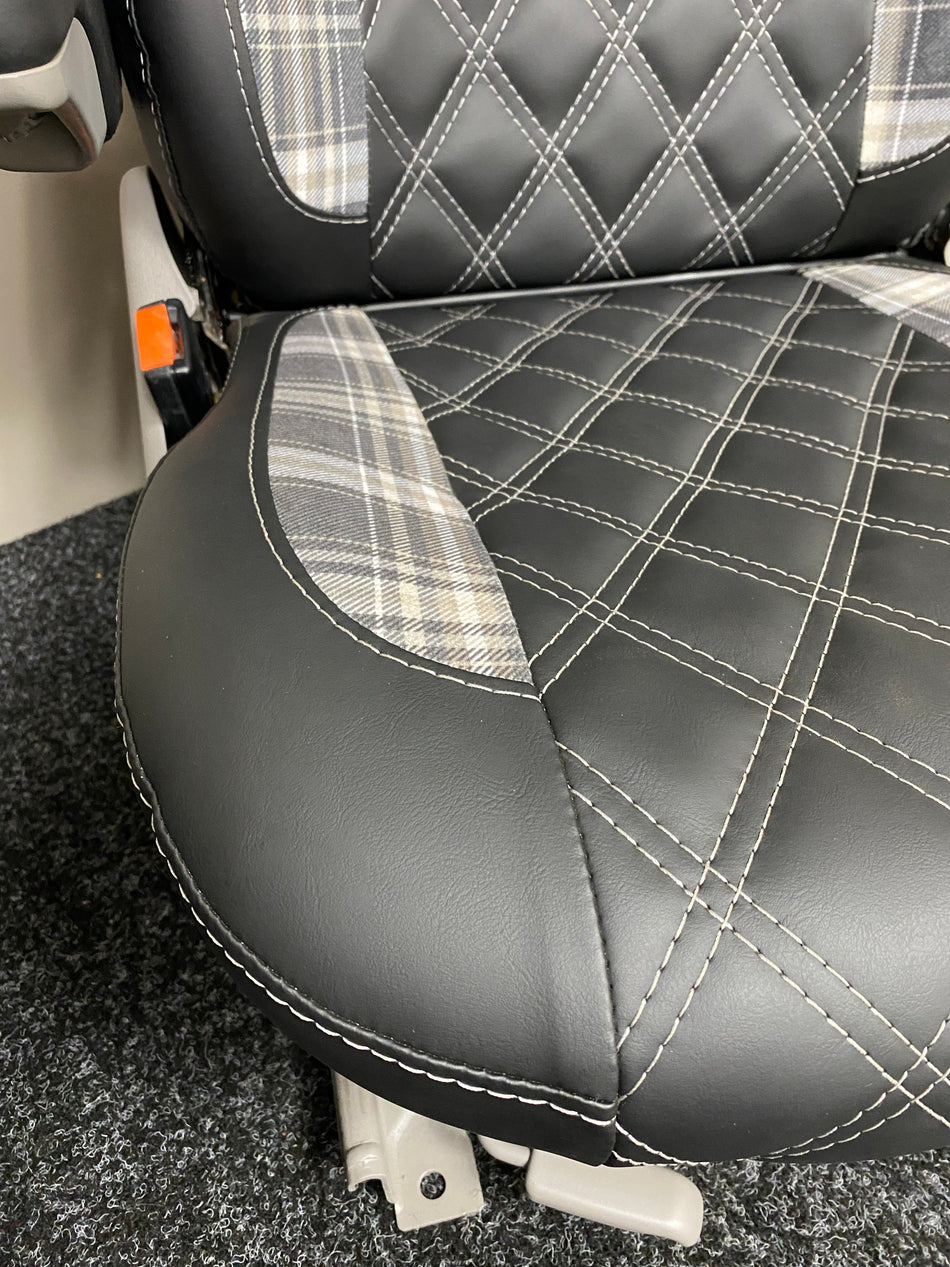 MK1 Replacement Swivel Captain Seat, close-up of black leatherette seat base with tartan side insert and white Bentley stitching detail.