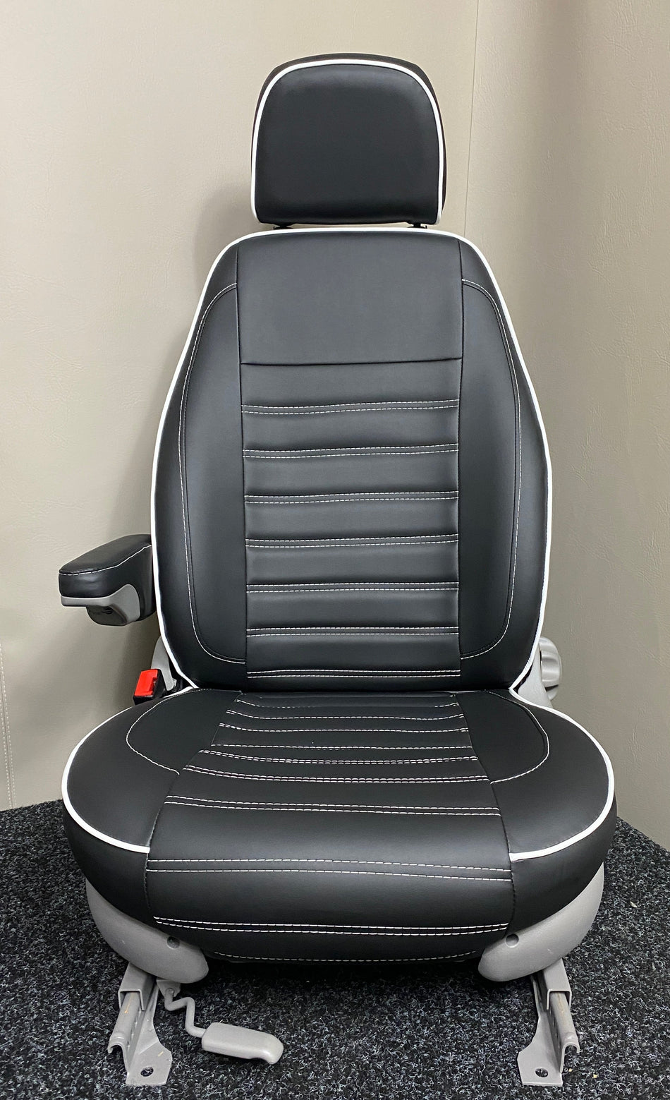 MK1 Replacement Swivel Captain Seat in black leatherette with white stitching, white piping, light grey plastic trim, and one armrest.