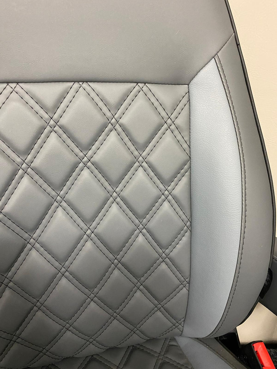 Close-up of MK2  Replacement Swivel Seat featuring dark grey leatherette, mid-grey inserts, and black Bentley cross-stitch pattern.