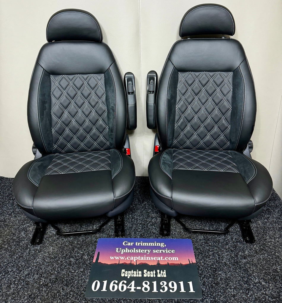 MK2 Replacement Swivel Captain Seats Passenger Height Adjustment in black real leather with black Alcantara inserts, black perforated real leather centre panel, and mild grey Bentley cross stitching. Single armrest on each seat.
