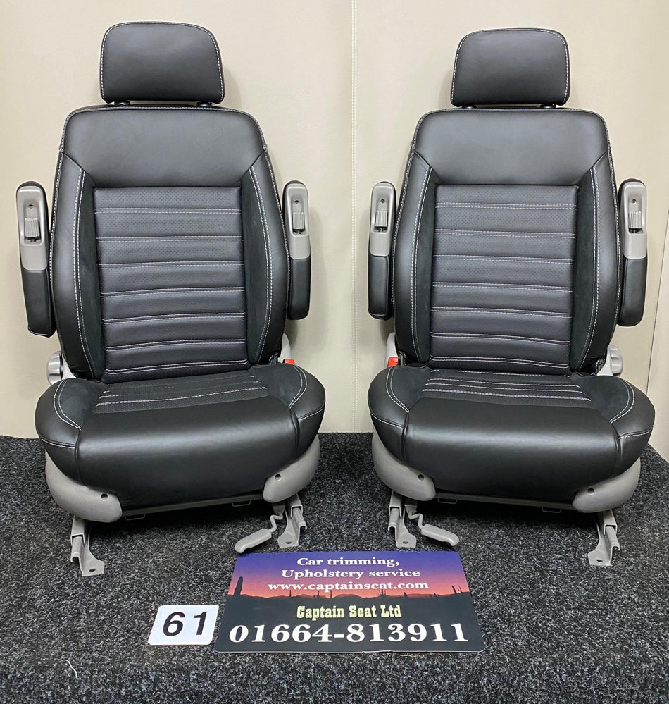 MK3 Replacement Swivel Captain Seats with black real leather, perforated center panels, Alcantara inserts, light grey stitching, and dual armrests in an upright position.