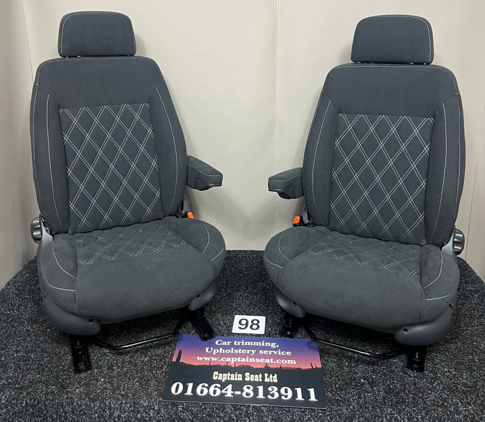 MK3 Replacement Swivel Captain Seats in black faux suede with Bentley stitch pattern, dark grey plastic trim, and single armrest on each seat.