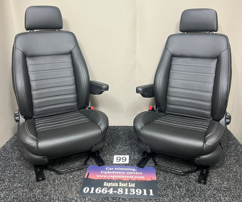 MK3 Replacement Swivel Captain Seats in black real leather with black perforated centre panel and mild grey horizontal wide stitching. Features a single armrest on each seat.