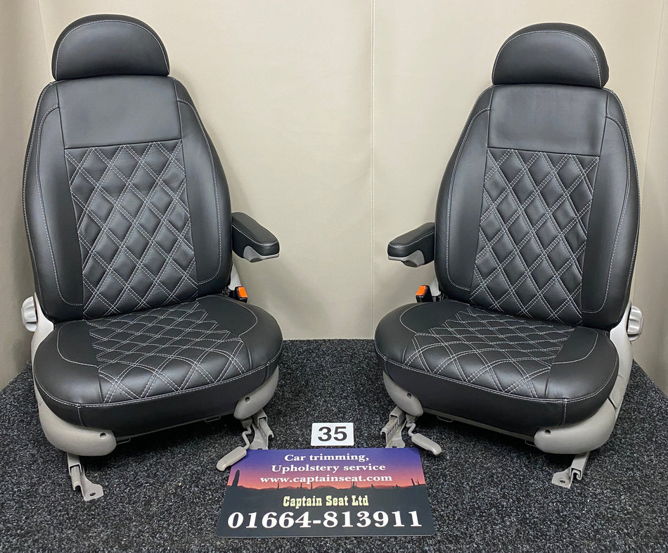 Pair of MK1 Replacement Swivel Captain Seats in black real leather with light grey Bentley stitching, light grey plastic trim, and one armrest per seat.