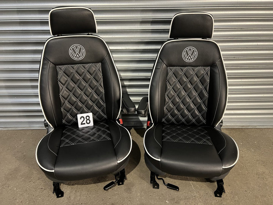 Pair of MK1 Swivel Replacement Captain Seats in matt black leatherette with Bentley stitch pattern, white piping and VW logos.