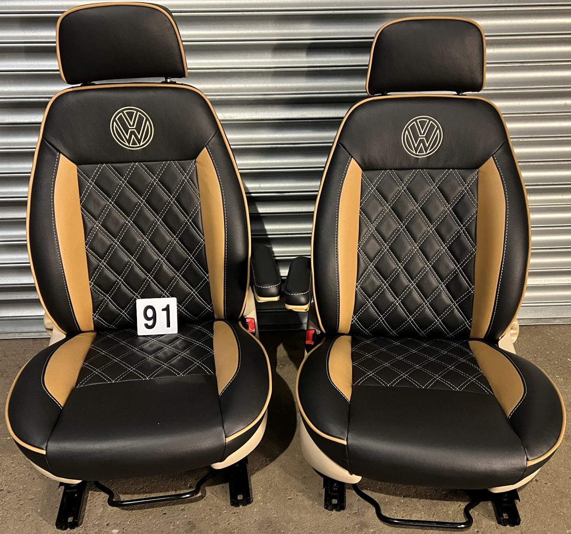Pair of MK1 Swivel Replacement Captain Seats in matt black leatherette with Bentley stitch pattern, beige inserts, piping and VW logos.