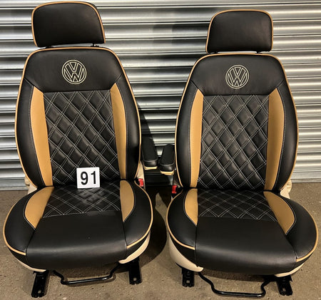 Pair of MK1 Swivel Replacement Captain Seats in matt black leatherette with Bentley stitch pattern, beige inserts, piping and VW logos.