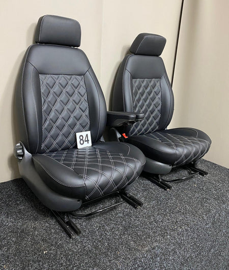 Heated MK2 Replacement Captain Seats in black Nappa leather with white diamond stitching, angled view