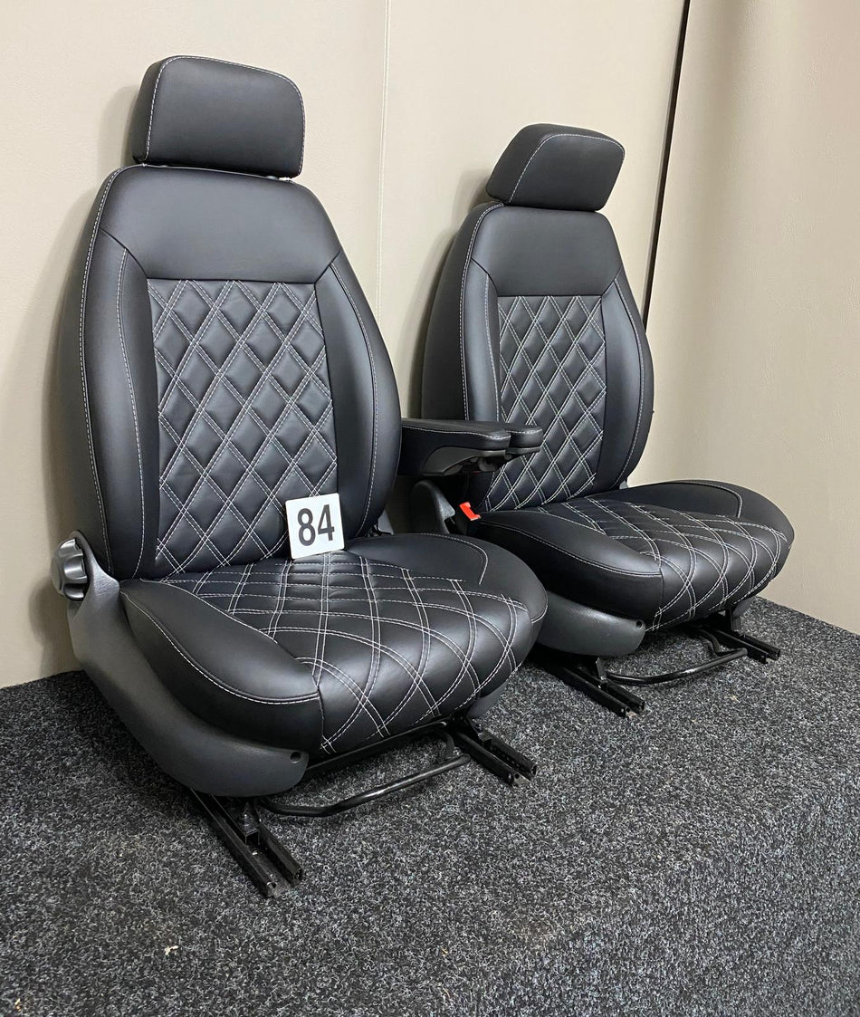 Heated MK2 Replacement Captain Seats in black Nappa leather with white diamond stitching, angled view