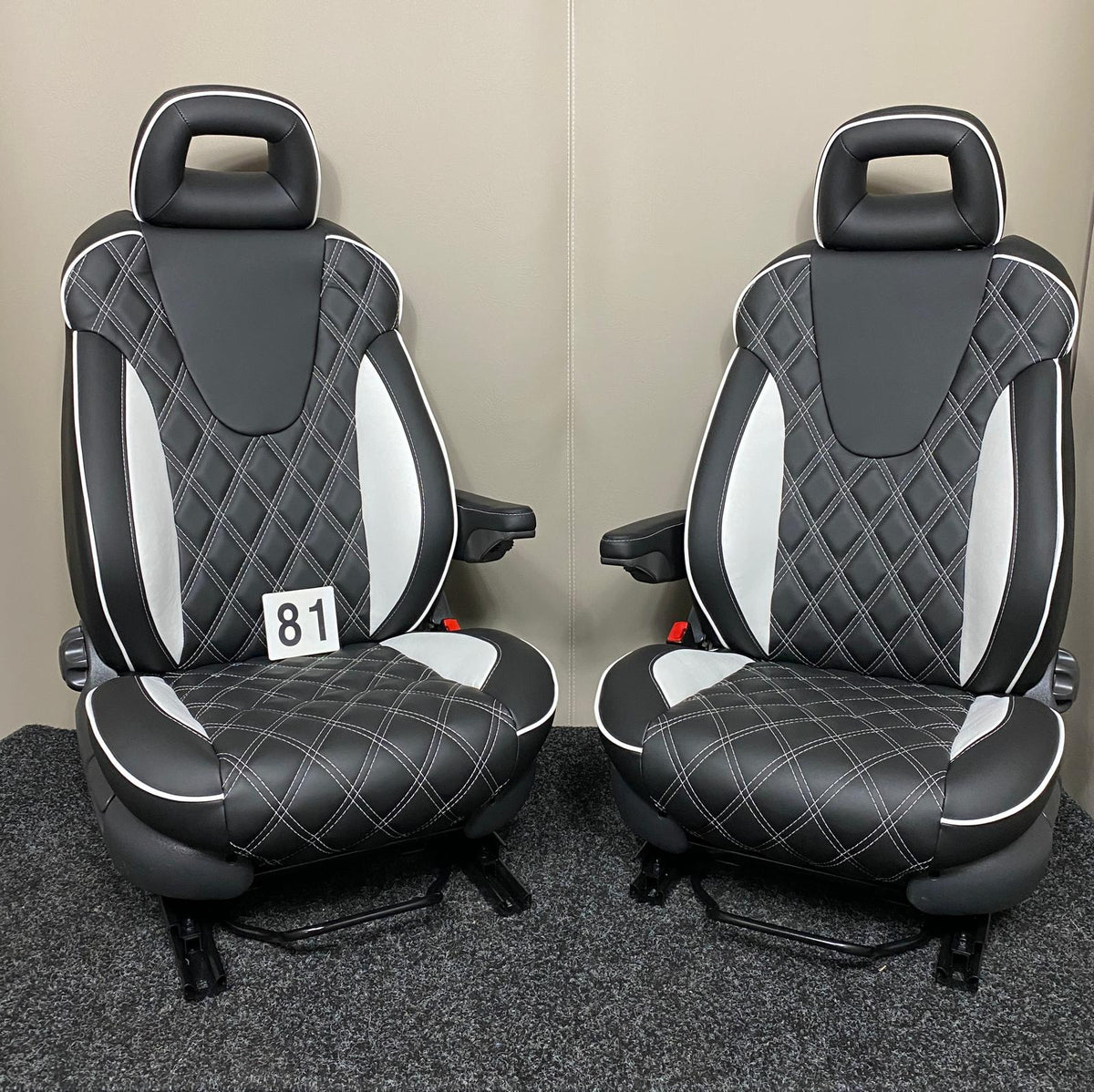 Pair of MK2 Replacement Captain Swivel Seats in black leatherette with white inserts, white piping and white diamond stitching