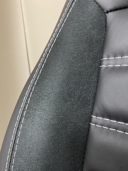 MK2 Replacement Captain Swivel Seat close-up, black Alcantara insert with white stitching