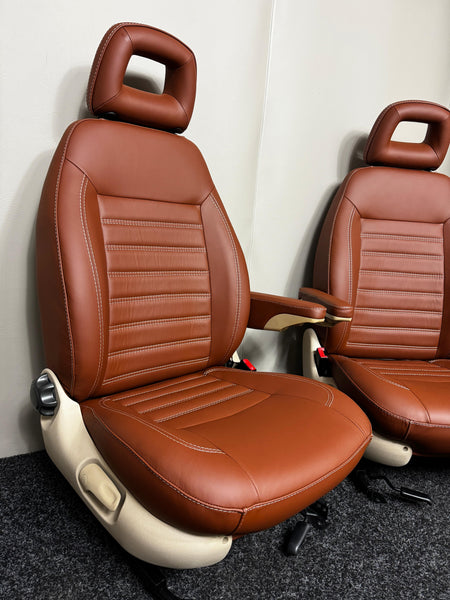 MK2 Replacement Captain Swivel Seats in brown Nappa leather, angled view with armrests
