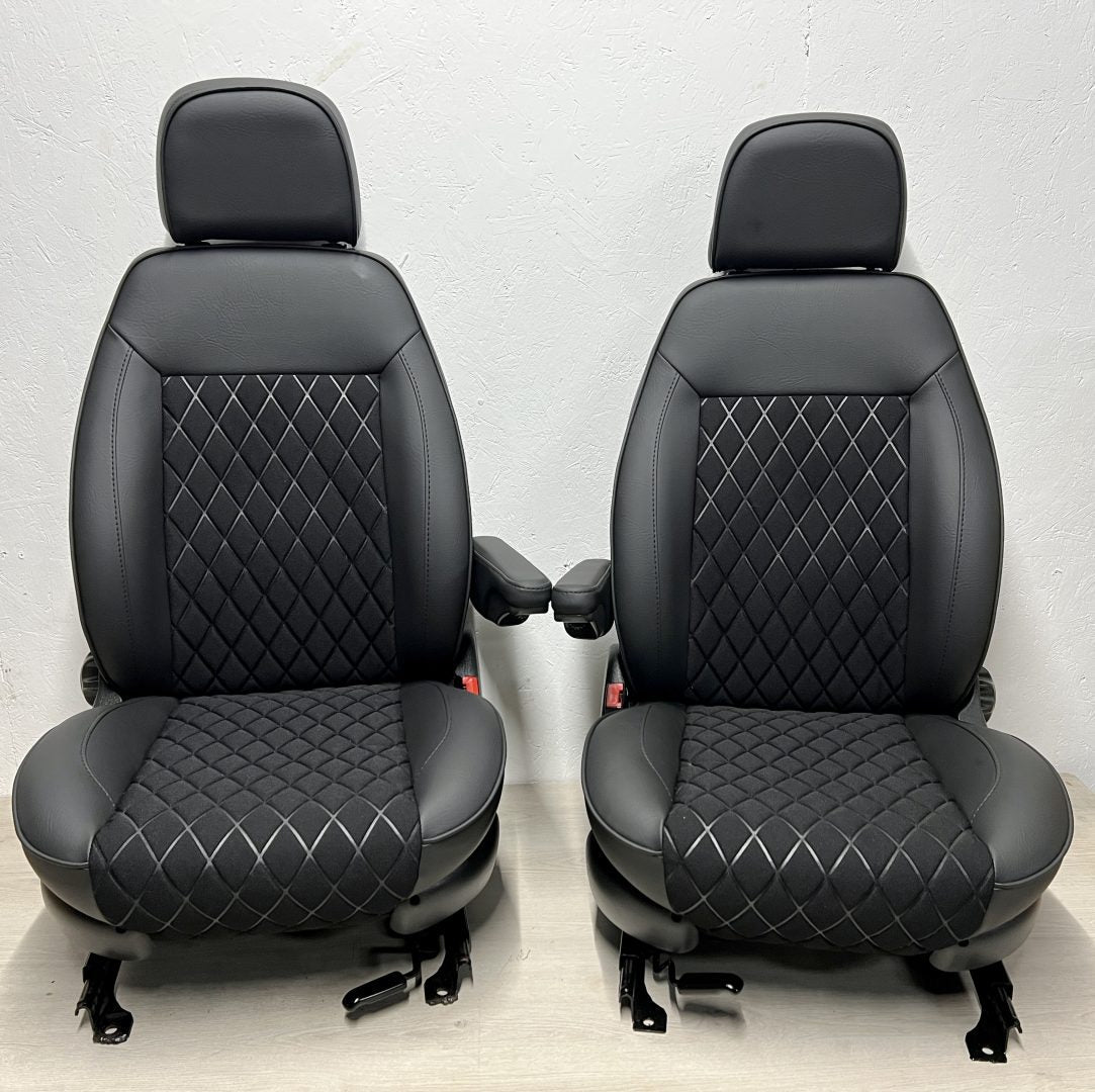 Pair of MK2 Swivel Replacement Captain Seats, front view showing matt black leatherette and black faux centre panels with Bentley stitch pattern.