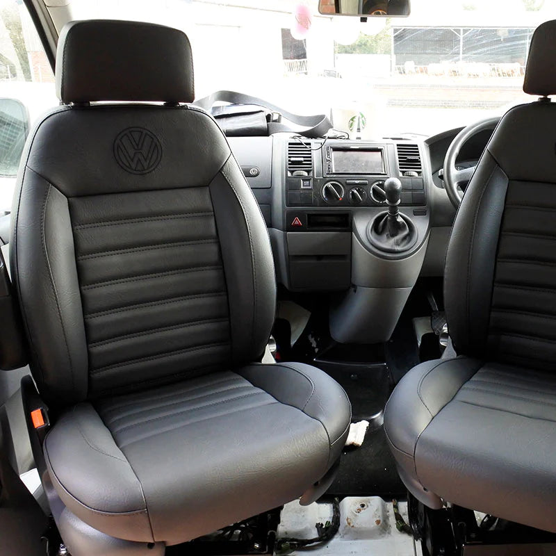 Pair of MK2 Swivel Replacement Captain Seats in black leatherette upholstery with horizontal stitching and black VW logo.