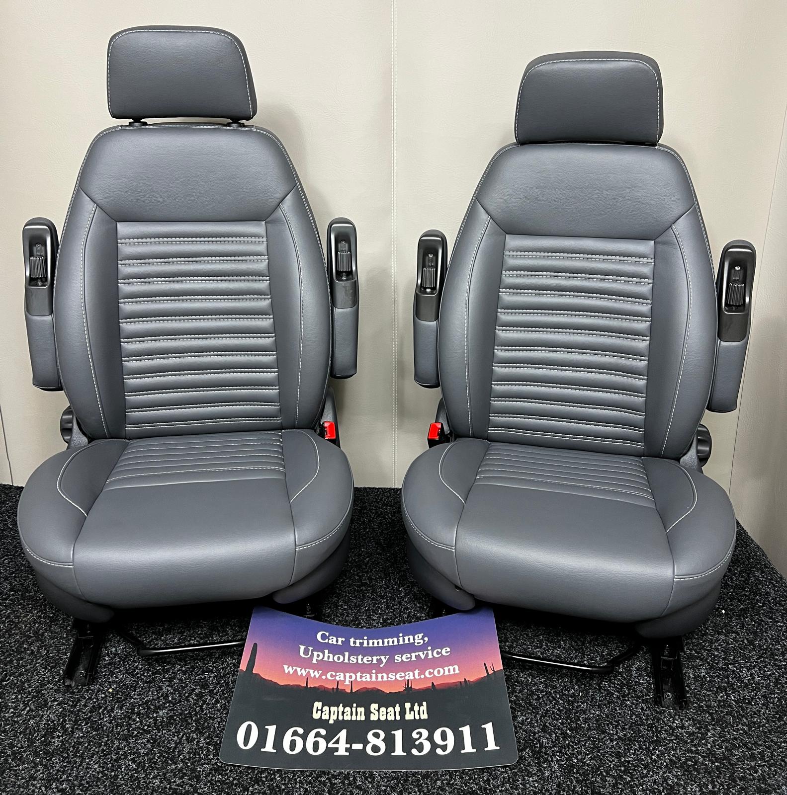 Pair of MK2 Swivel Replacement Captain Seats in grey leatherette with wide horizontal stitching.