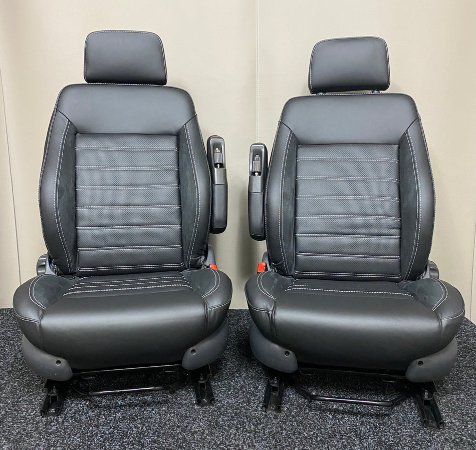 Pair of MK3 Swivel Replacement Captain Seats, front view showing matt black leatherette with horizontal stitching and grey Alcantara vertical inserts.