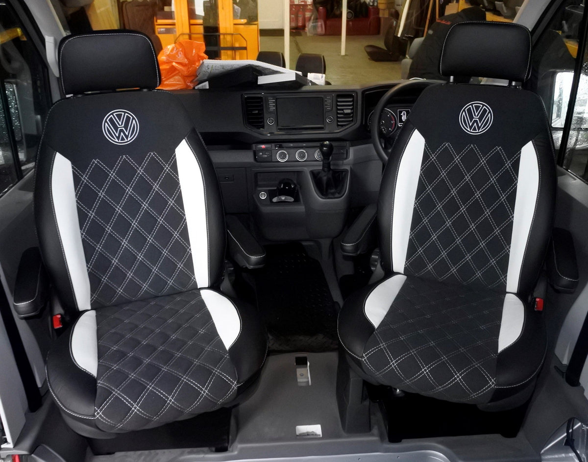Pair of VW Crafter Replacement Swivel Captain Seats, in matt black real Nappa leather with white full Bentley stitch pattern, white inserts, white VW logos and black micro fibre centre panels.
