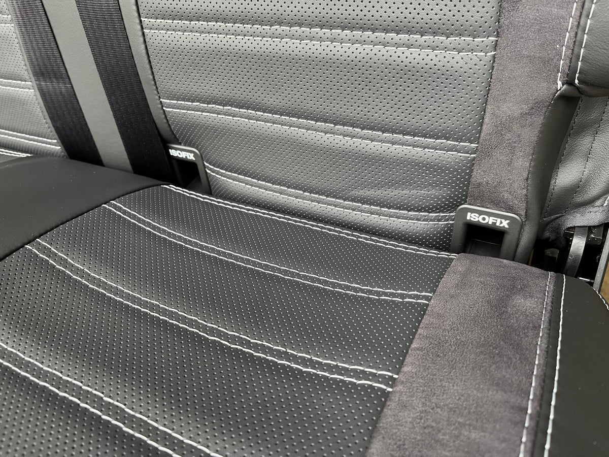 RIB Altair 130 with Isofix close-up, perforated Nappa leather centre panel, Isofix attachment points, black Alcantara insert, light grey stitching.