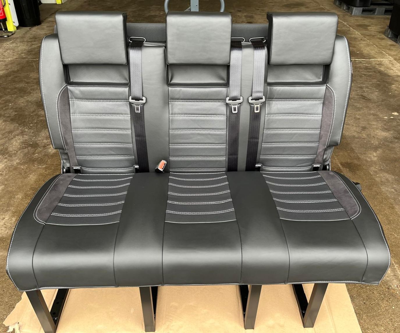 RIB Altair 130 with Isofix, black Nappa leather seats with perforated centre panel, black Alcantara inserts, light grey stitching, and integrated seatbelts.