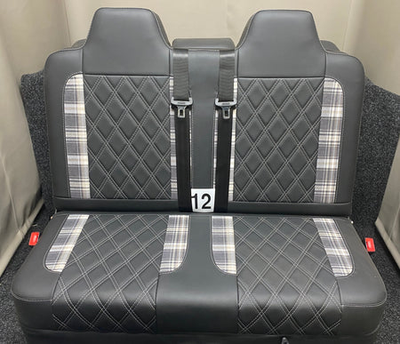 Rock and Roll Bed 3/4 Size M1 Legged Gas Assisted, straight-on view highlighting tartan inserts and white Bentley stitching on black leatherette upholstery.