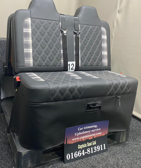 Rock and Roll Bed 3/4 Size M1 Legged Gas Assisted, angled view showing black leatherette base with tartan inserts and white Bentley stitching, with seatbelts.
