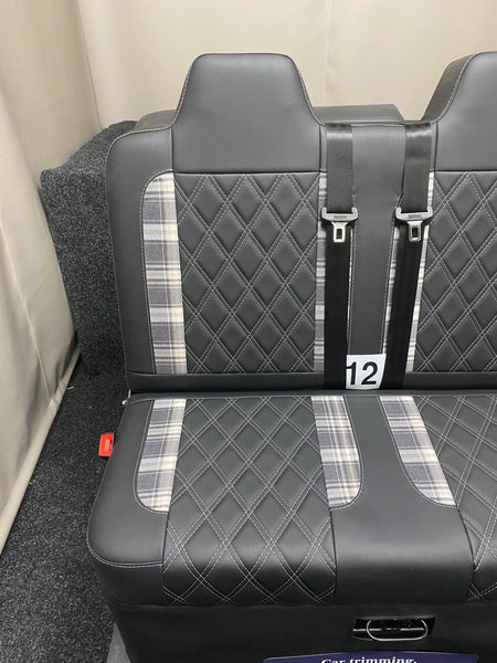 Rock and Roll Bed 3/4 Size M1 Legged Gas Assisted, with black leatherette upholstery, tartan inserts, and white Bentley stitching, shown with seatbelt detail.