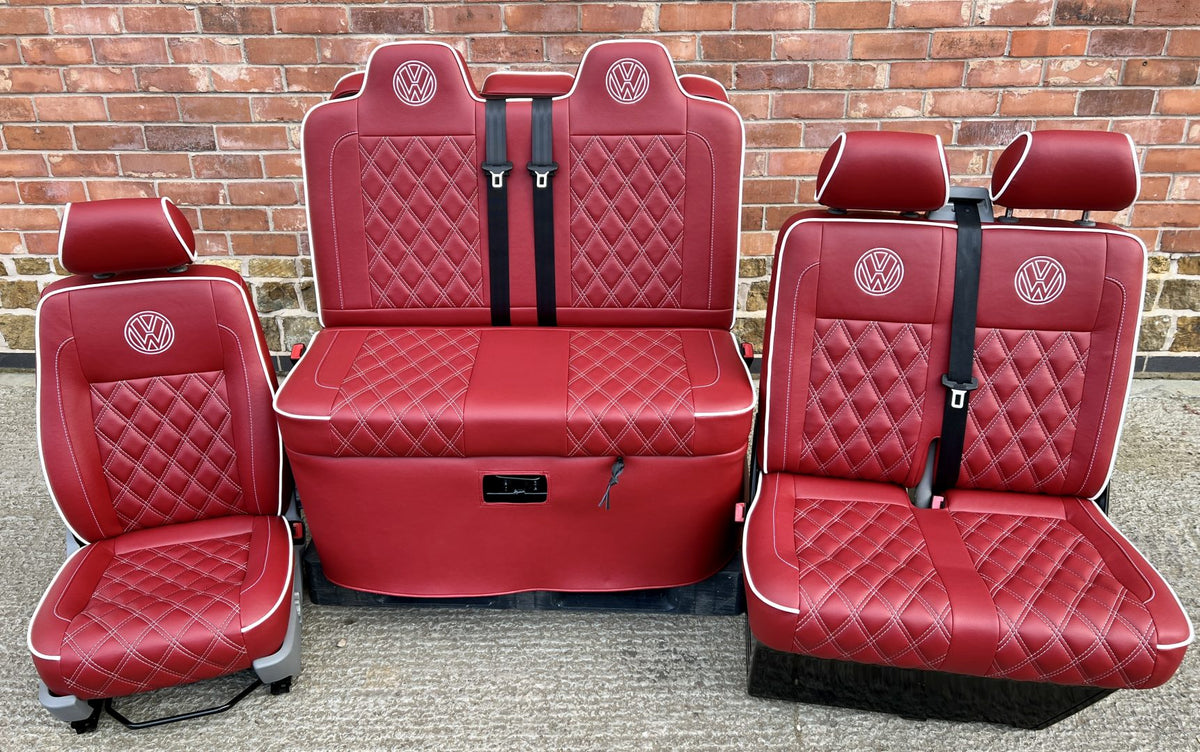 Rock and roll bed and front seats VW T5 T6 in red leatherette with white piping, cross stitching and VW logos.