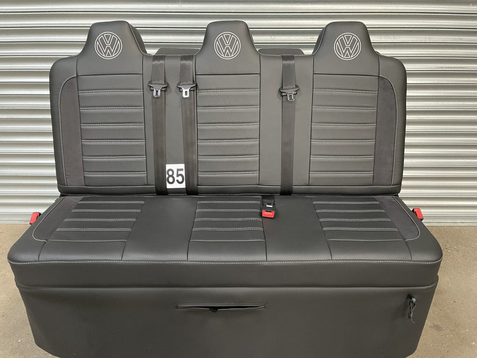 Rock and roll bed full size 3 seater M1 tested gas assisted reverse opening in black smooth nappa leather with black Alcantara inserts, light grey horizontal stitching and VW logos.