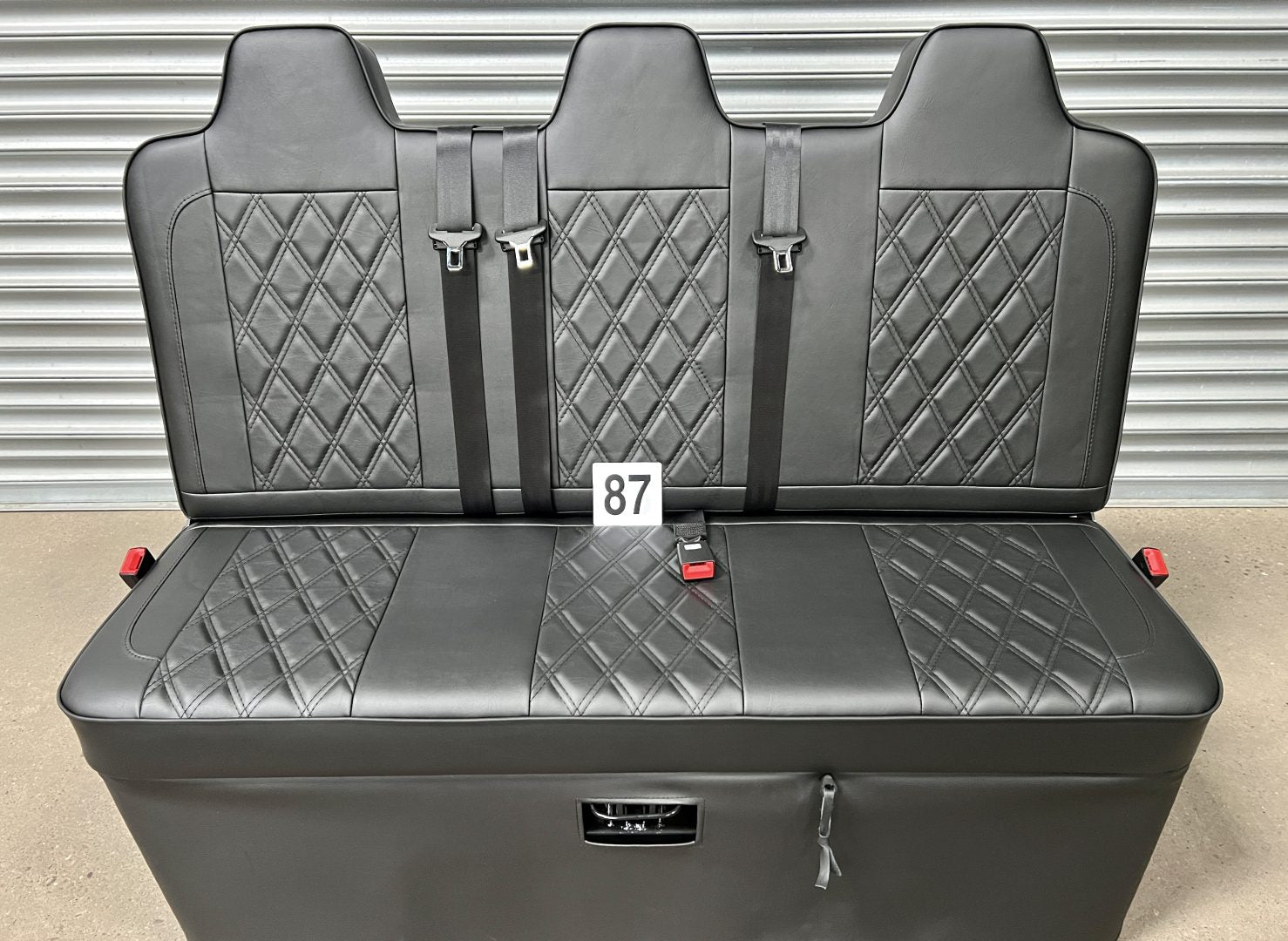 Rock and roll bed full width 3 seater M1 tested gas assisted in black leatherette with Bentley stitching and black piping.