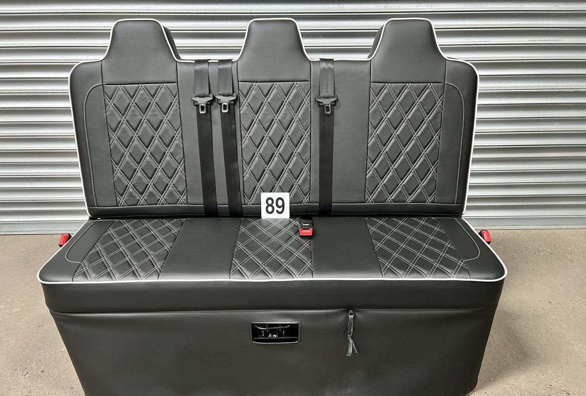 Rock and roll bed full width 3 seater M1 tested gas assisted in black leatherette with white Bentley stitching and piping.
