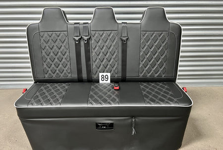 Rock and roll bed full width 3 seater M1 tested gas assisted in black leatherette with white Bentley stitching and piping.