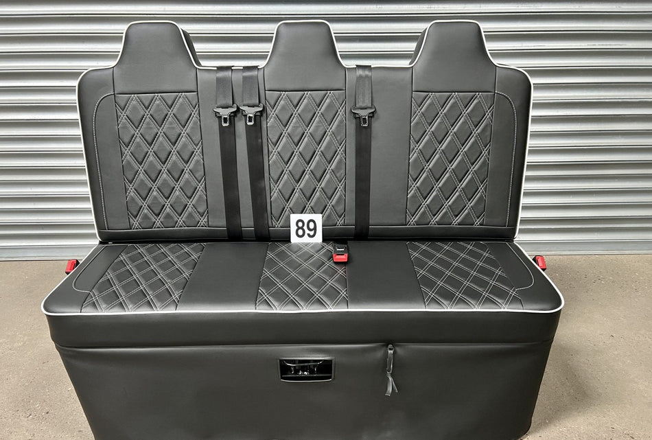 Rock and roll bed full width 3 seater M1 tested gas assisted in black leatherette with white Bentley stitching and piping.