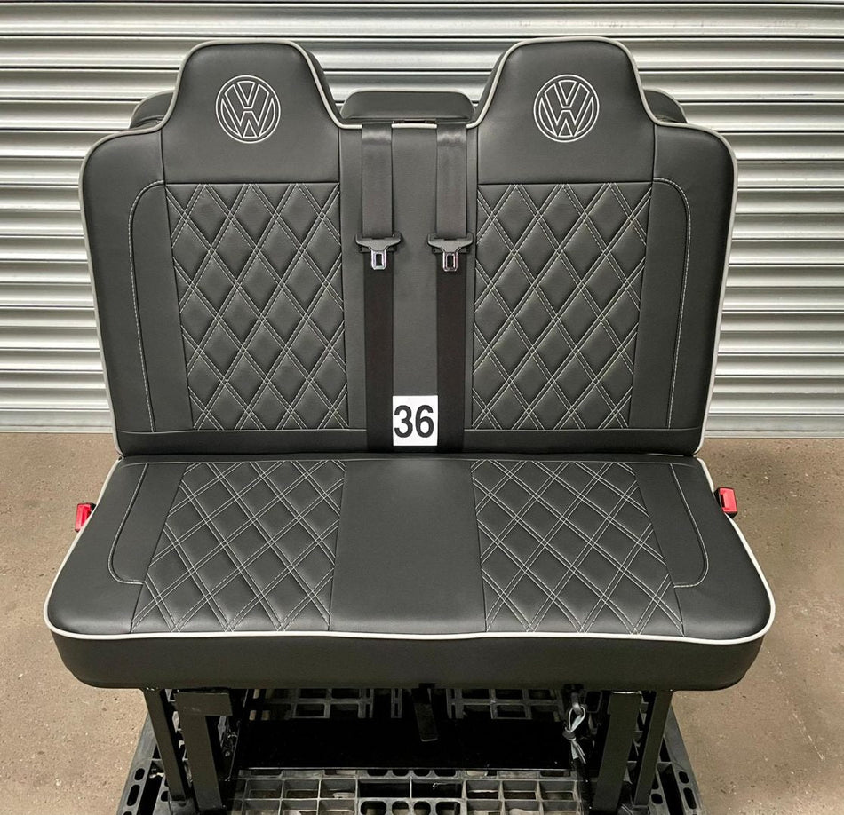 Rock and roll bed M1 tested 3/4 gas assisted in black leatherette with light grey Bentley stitching, piping and VW logos.