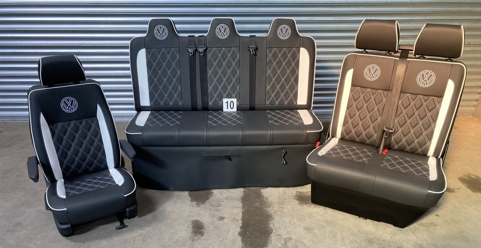 Rock and roll bed M1 tested full size gas assisted and matching front seats in black leatherette with white cross stitching, inserts, piping and VW logos.