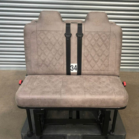 Rock and Roll Bed Two Seater M1 tested 3/4 Gas Assisted in beige fabric material with Bentley stitching, VW logos, and integrated black seat belts.