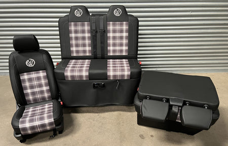 Rock and roll bed VW T5 T6 + Front seats 2+1 in Black leatherette, with  tartan centre panels and grey graffiti VW logos, the double seat is folded down.