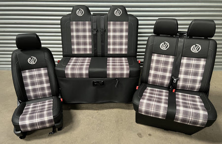 Rock and roll bed VW T5 T6 + Front seats 2+1 in Black leatherette, with upgraded tartan fabric centre panels and graffiti VW logos in grey.