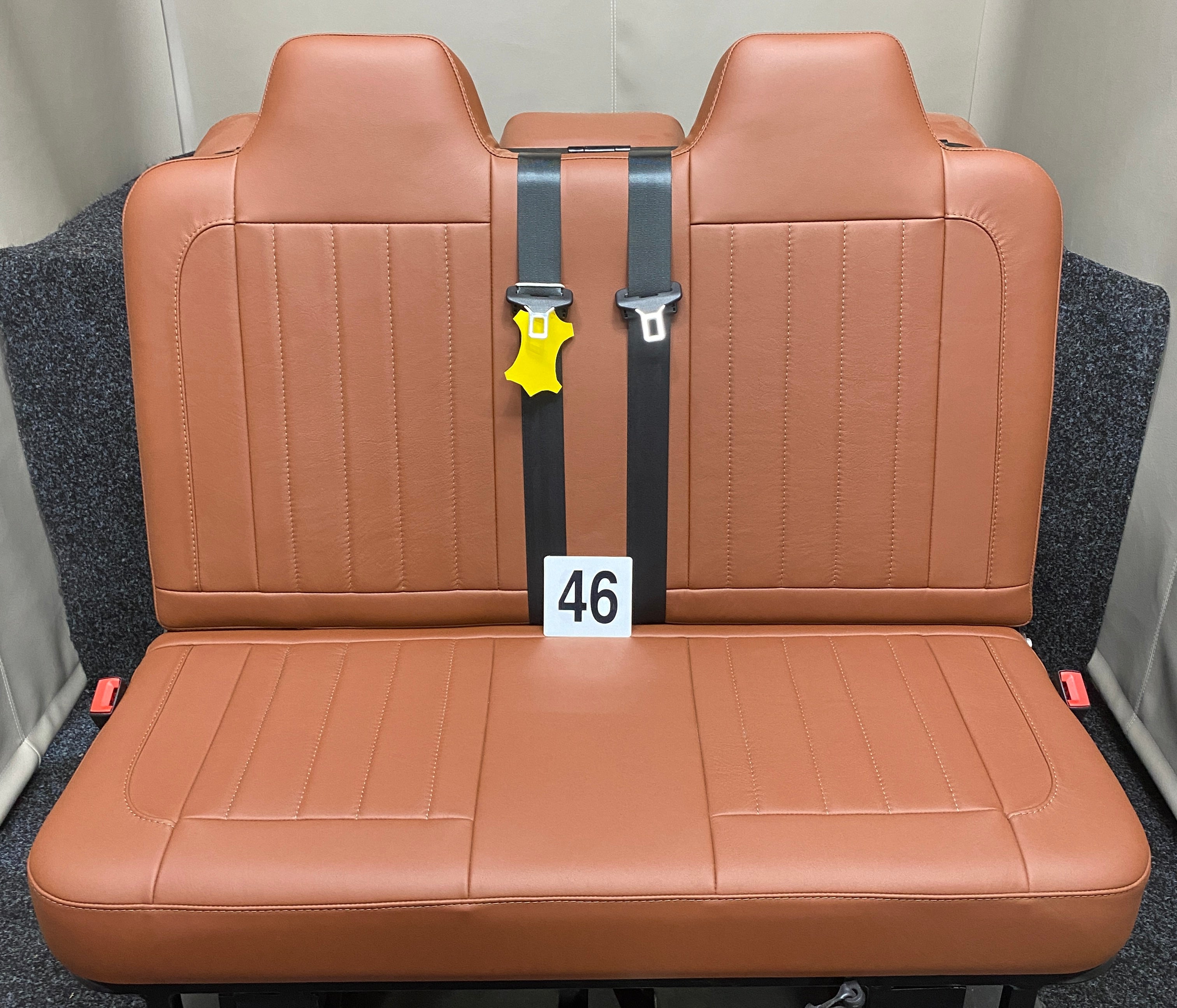 Rock & Roll Bed 3/4 M1 Tested 2 Seater, front view of brown real leather seat with brown vertical stitching.