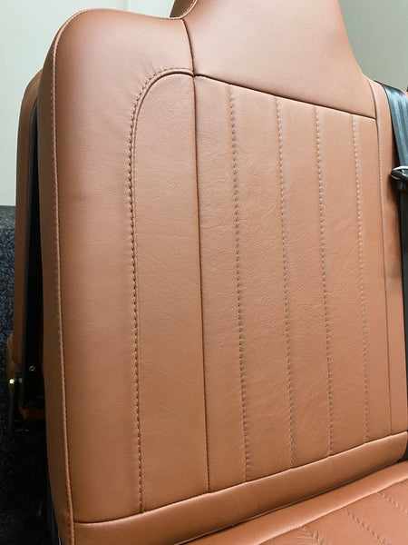 Rock & Roll Bed 3/4 M1 Tested 2 Seater, angled close-up of brown real leather backrest with vertical stitching.